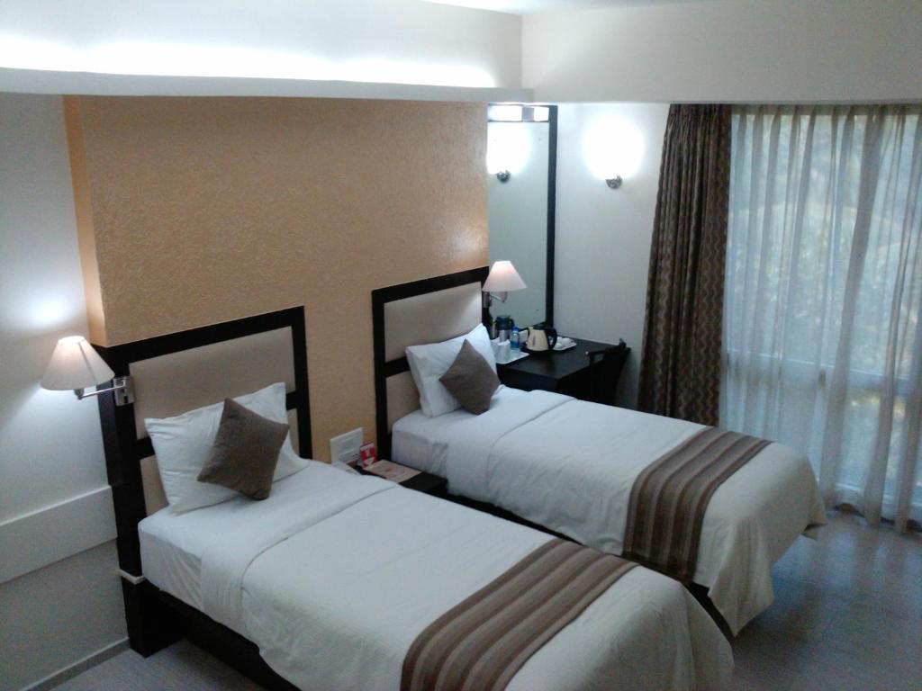 Pattom Royal Hotel Thiruvananthapuram Habitación foto